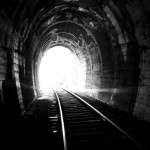Light on the end of railway tunnel.